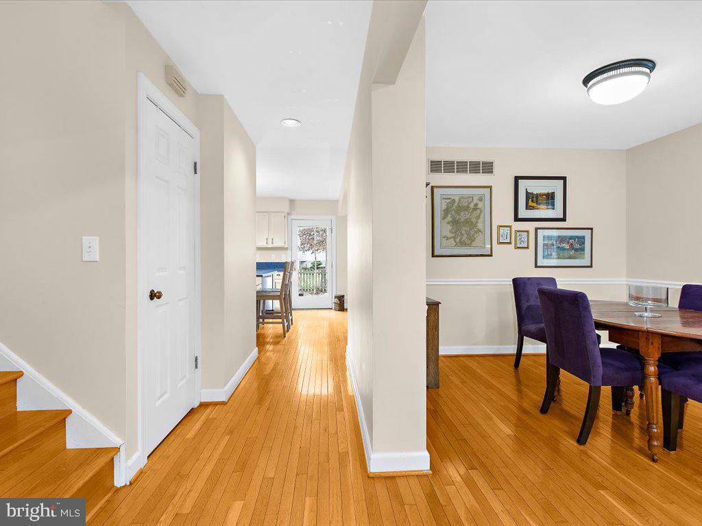 1560 Ritchie Lane Annapolis, MD 21401 - Photo 15 of 54 a view of a dining room with furniture and wooden floor
