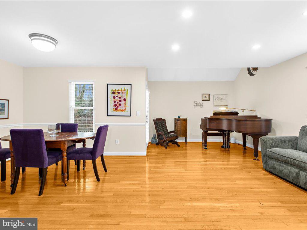 1560 Ritchie Lane Annapolis, MD 21401 - Photo 16 of 54 a view of a dining room with furniture and wooden floor