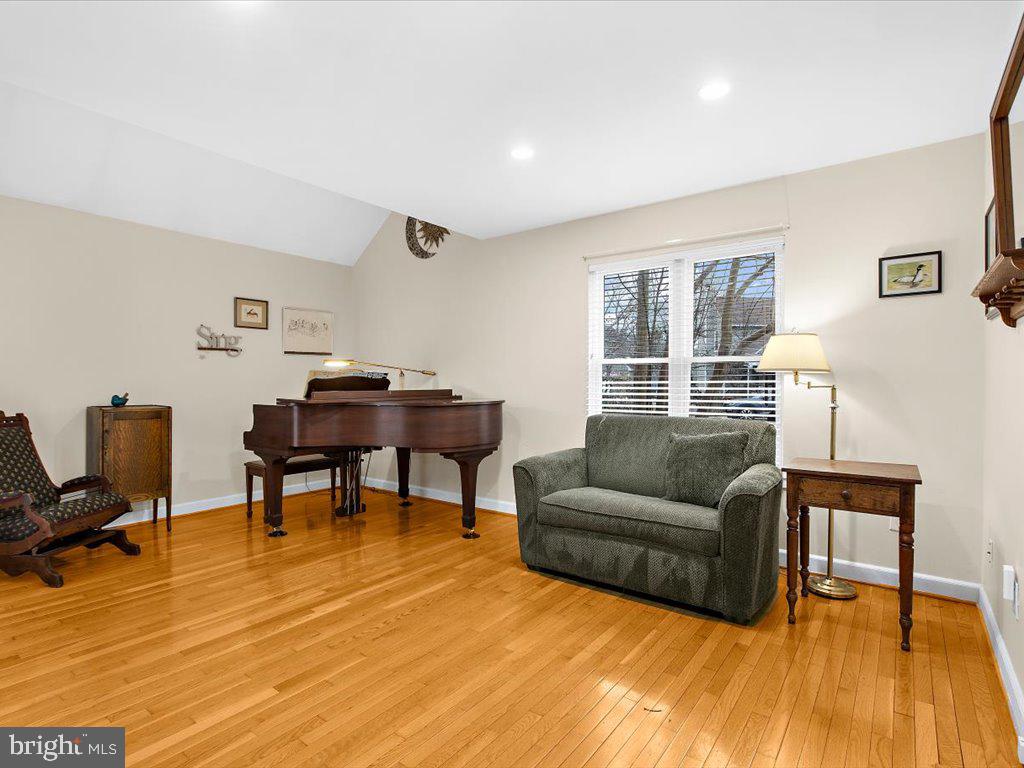 1560 Ritchie Lane Annapolis, MD 21401 - Photo 20 of 54 a living room with furniture and a wooden floor