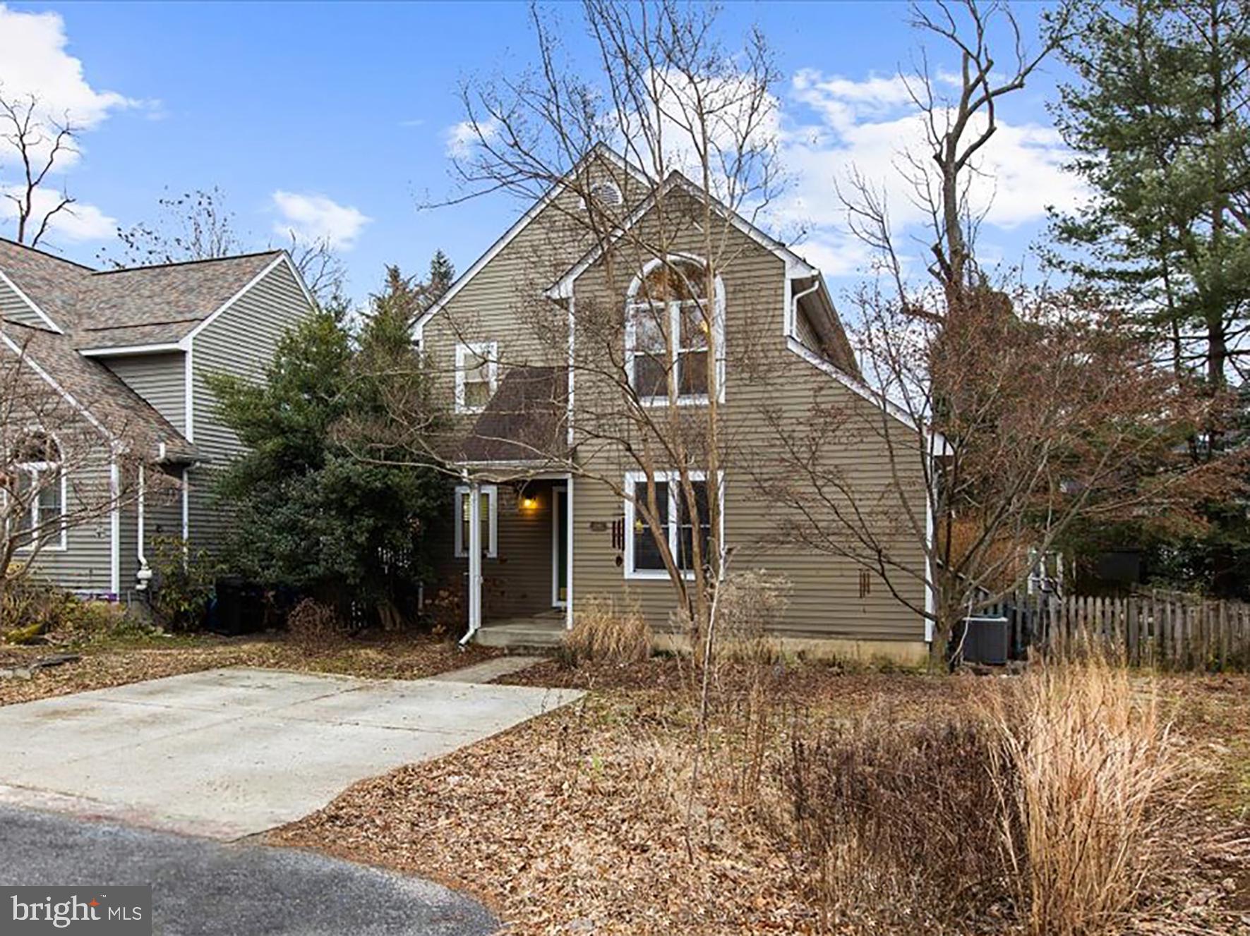 1560 Ritchie Lane Annapolis, MD 21401 - Photo 2 of 54 a front view of a house with a yard
