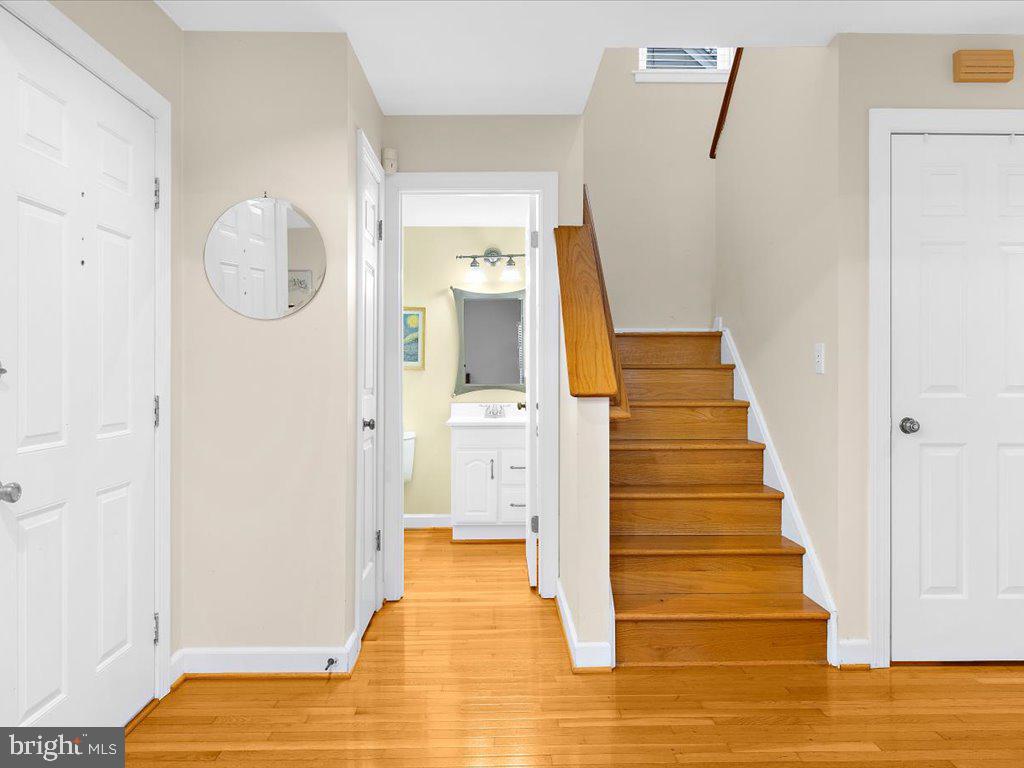 1560 Ritchie Lane Annapolis, MD 21401 - Photo 21 of 54 a view of a hallway with wooden floor and entryway