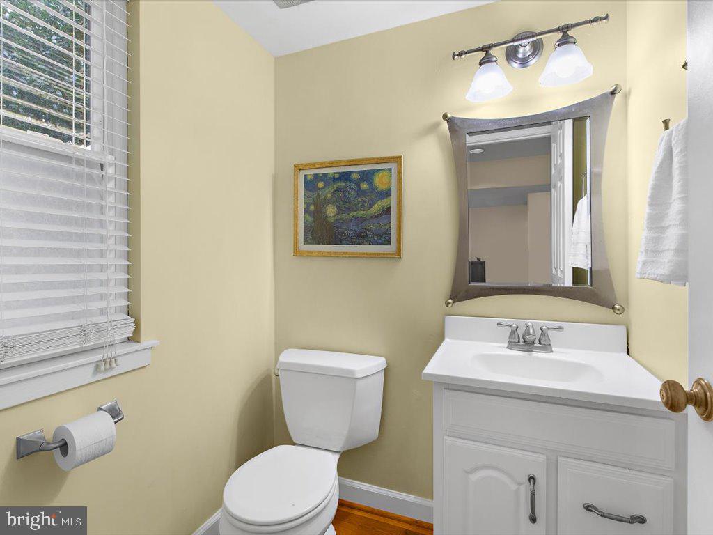 1560 Ritchie Lane Annapolis, MD 21401 - Photo 22 of 54 a bathroom with a sink mirror vanity and toilet