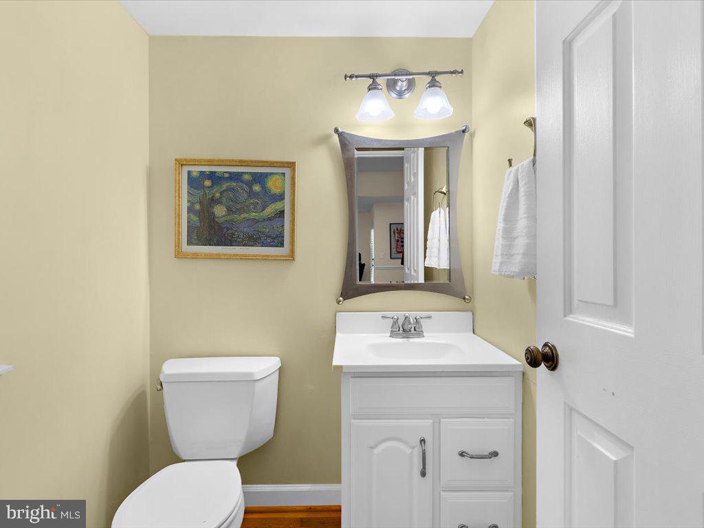 1560 Ritchie Lane Annapolis, MD 21401 - Photo 23 of 54 a bathroom with a toilet sink and mirror