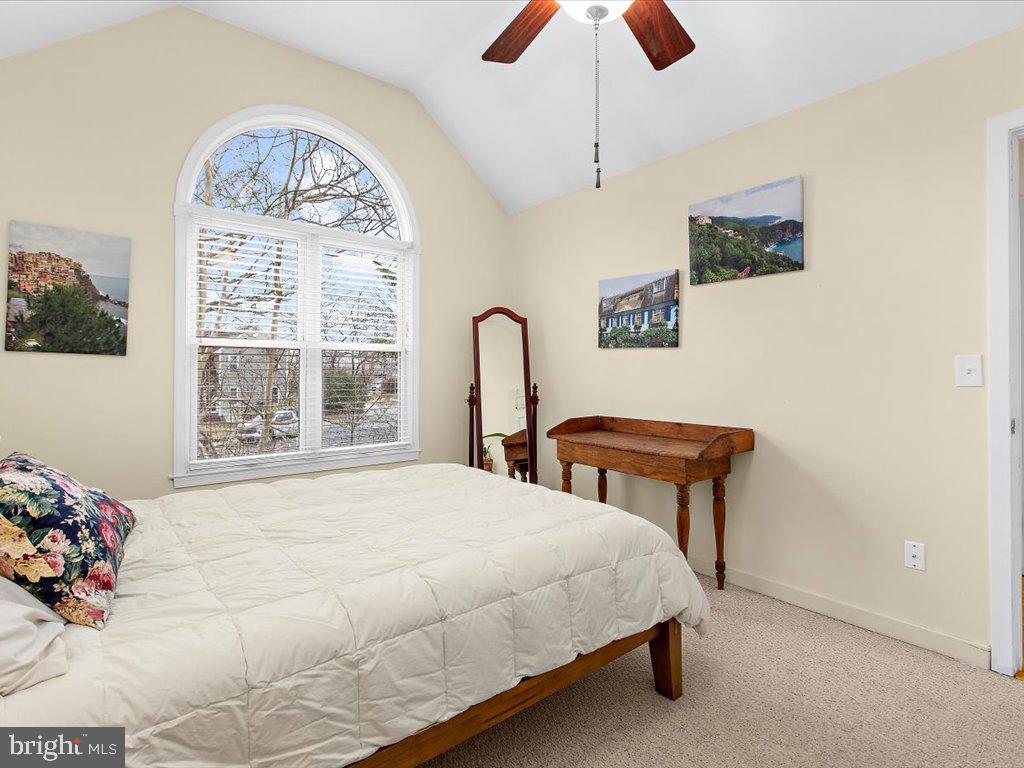 1560 Ritchie Lane Annapolis, MD 21401 - Photo 25 of 54 a bedroom with a bed and a chandelier