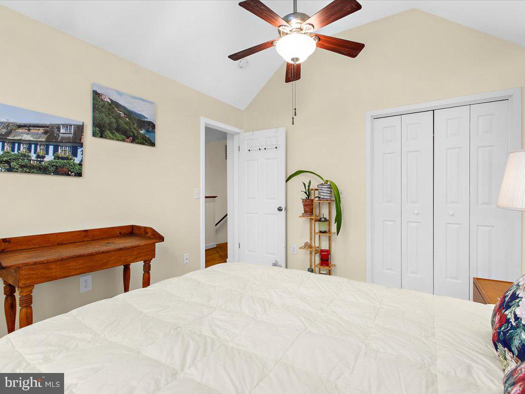 1560 Ritchie Lane Annapolis, MD 21401 - Photo 26 of 54 a bedroom with a bed and a chandelier