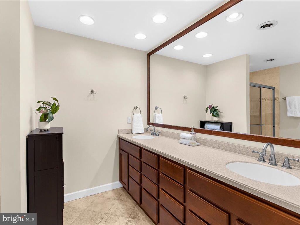 1560 Ritchie Lane Annapolis, MD 21401 - Photo 32 of 54 a bathroom with a sink and a mirror