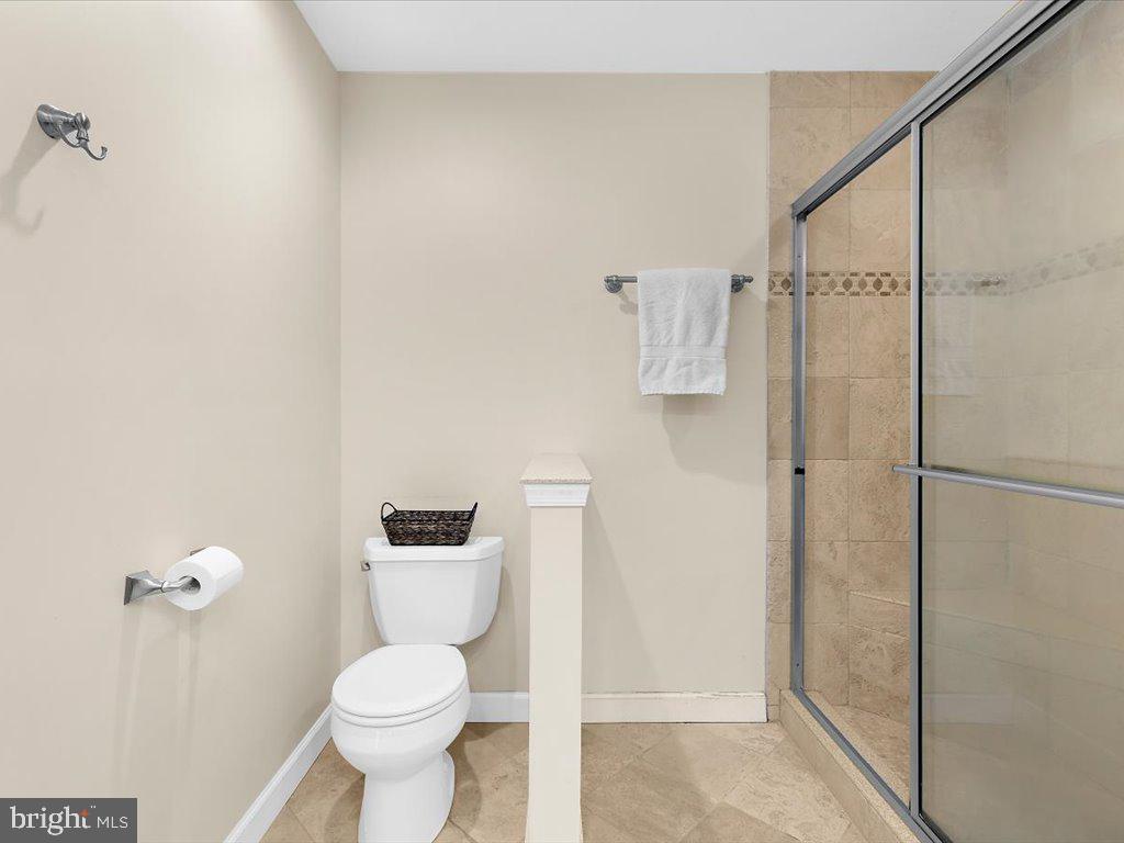 1560 Ritchie Lane Annapolis, MD 21401 - Photo 35 of 54 a bathroom with a toilet and a shower
