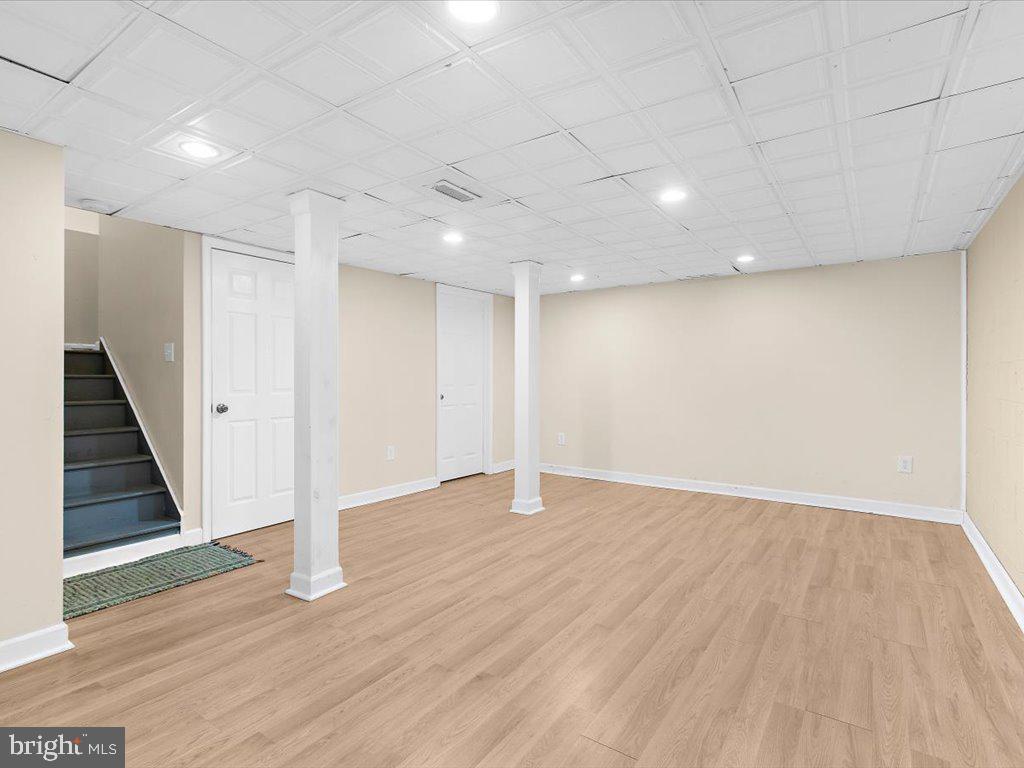 1560 Ritchie Lane Annapolis, MD 21401 - Photo 37 of 54 a view of an empty room with wooden floor and entryway
