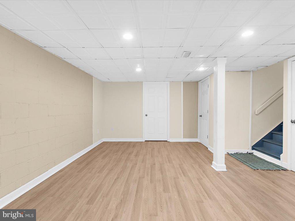 1560 Ritchie Lane Annapolis, MD 21401 - Photo 39 of 54 an empty room with wooden floor and entryway