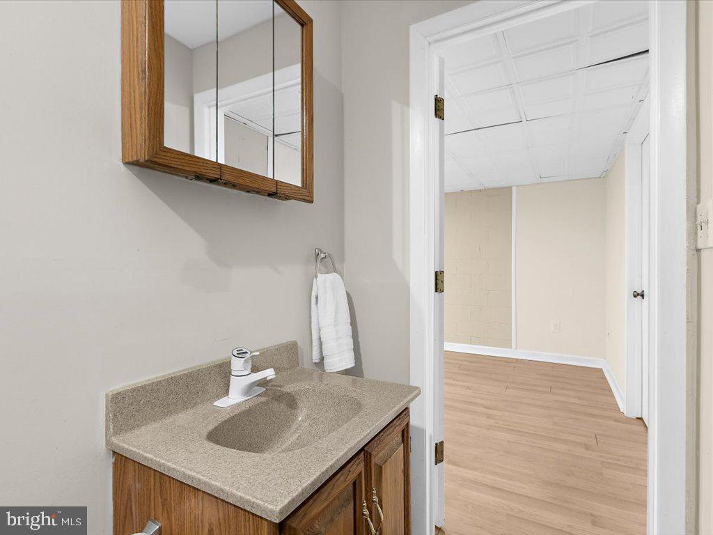 1560 Ritchie Lane Annapolis, MD 21401 - Photo 41 of 54 a bathroom with a sink and a mirror
