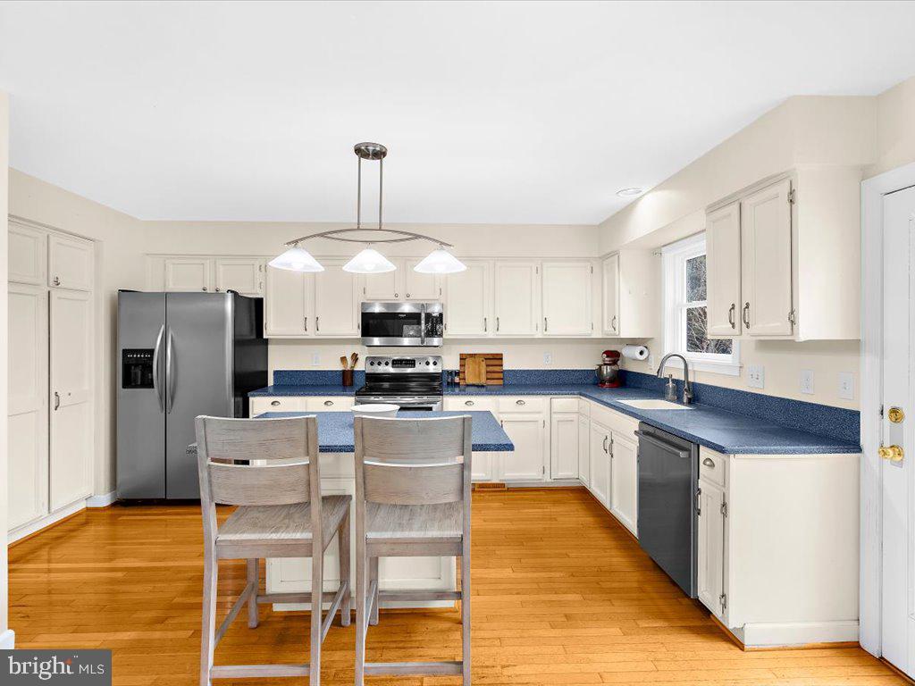 1560 Ritchie Lane Annapolis, MD 21401 - Photo 6 of 54 a open kitchen with stainless steel appliances granite countertop a stove top oven a refrigerator a sink and a island