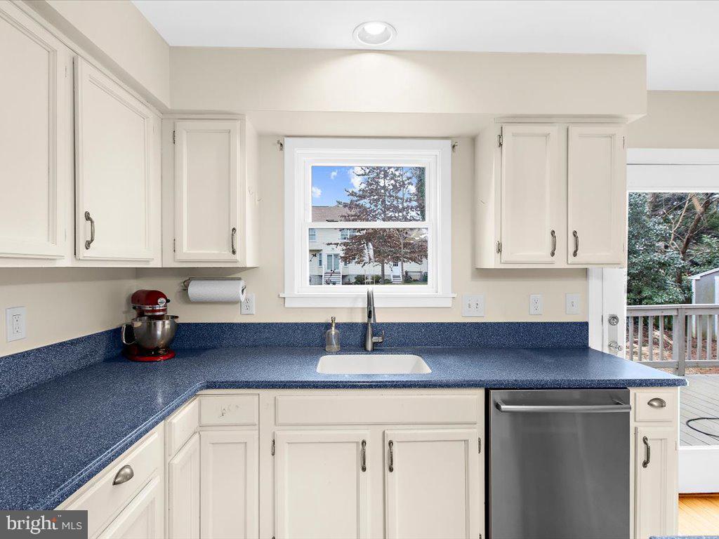 1560 Ritchie Lane Annapolis, MD 21401 - Photo 9 of 54 a kitchen with stainless steel appliances granite countertop a sink a cabinets and window