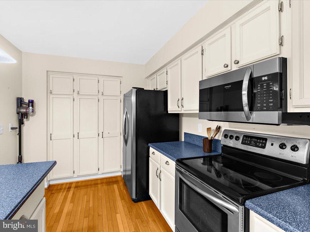 1560 Ritchie Lane Annapolis, MD 21401 - Photo 10 of 54 a kitchen with a refrigerator stove and microwave