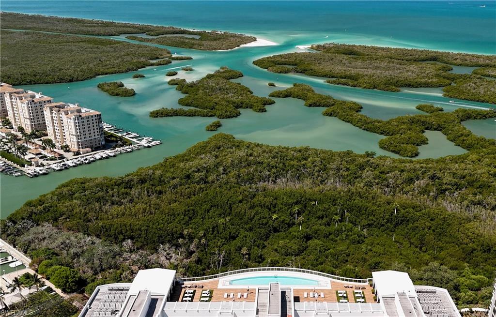 13915 Old Coast Road, Unit 302 Naples, FL 34110 - Photo 40 of 40 an aerial view of a house with a yard
