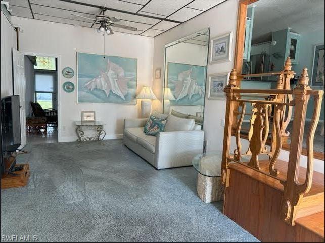 186 Panther Pass Circle, Unit 186 Naples, FL 34114 - Photo 11 of 50 a living room with furniture and a fireplace