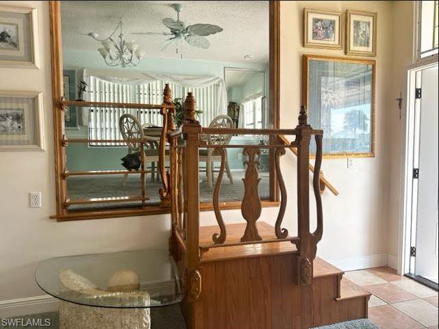 186 Panther Pass Circle, Unit 186 Naples, FL 34114 - Photo 13 of 50 a view of a livingroom with furniture and hardwood floor