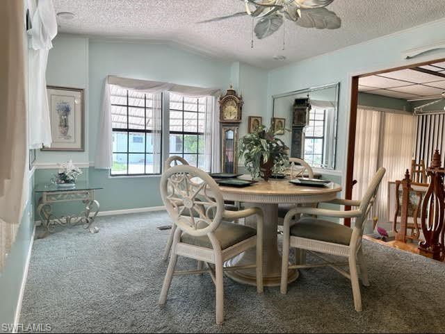 186 Panther Pass Circle, Unit 186 Naples, FL 34114 - Photo 19 of 50 a dining room with furniture and window