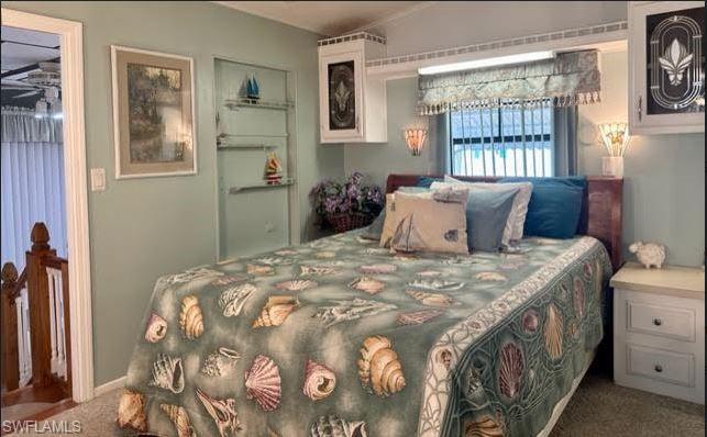 186 Panther Pass Circle, Unit 186 Naples, FL 34114 - Photo 30 of 50 a bedroom with a bed and a window