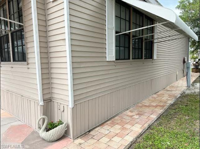 186 Panther Pass Circle, Unit 186 Naples, FL 34114 - Photo 7 of 50 a view of a house with backyard and furniture