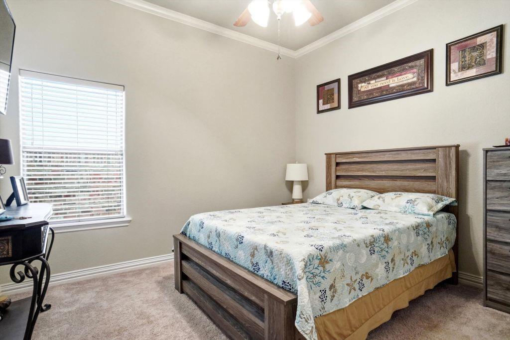 620 Highview Lane Hurst, TX 76054 - Photo 30 of 40 a bedroom with a bed and a window