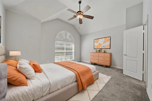 a bedroom with bed and a window