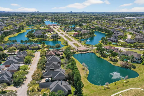 an aerial view of residential houses with outdoor space