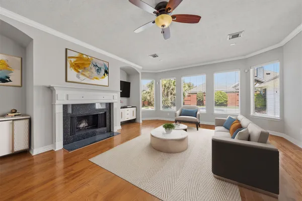 a living room with furniture and a fireplace