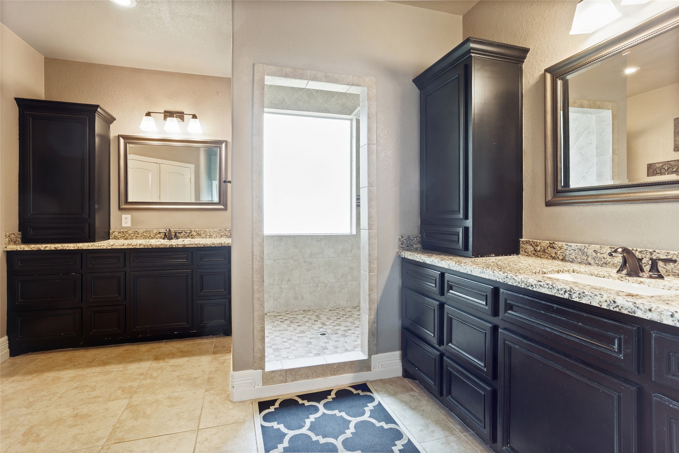7842 Pebble Hill Lane Rosharon, TX 77583 - Photo 17 of 33 a bathroom with a granite countertop sink and a mirror