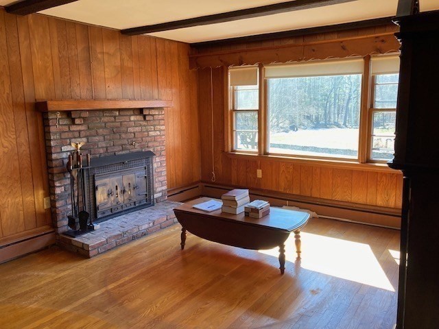 52 Peach Hill Road Berlin, MA 01503 - Photo 11 of 27 a living room with furniture and a fireplace