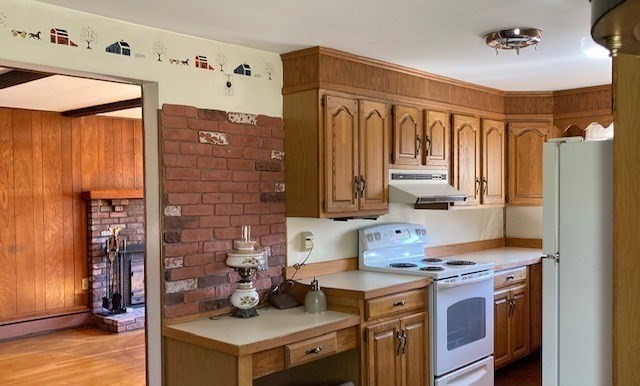 52 Peach Hill Road Berlin, MA 01503 - Photo 16 of 27 a kitchen with stainless steel appliances granite countertop a stove and a refrigerator