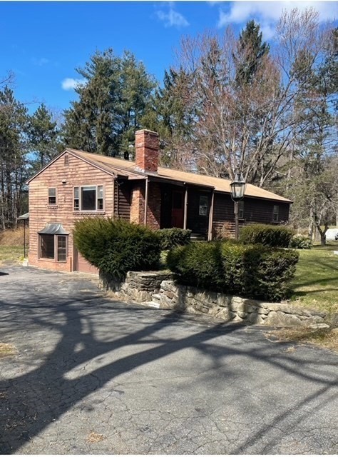52 Peach Hill Road Berlin, MA 01503 - Photo 2 of 27 front view of a house with a street