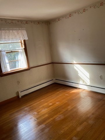 52 Peach Hill Road Berlin, MA 01503 - Photo 21 of 27 an empty room with wooden floor and windows