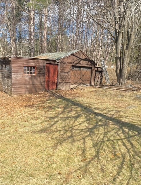 52 Peach Hill Road Berlin, MA 01503 - Photo 8 of 27 a view of a yard with an outdoor space