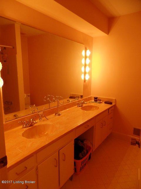 707 Farmingham Road Louisville, KY 40243 - Photo 21 of 23 Large full hall bathroom with double sink vanity and tub/shower combo