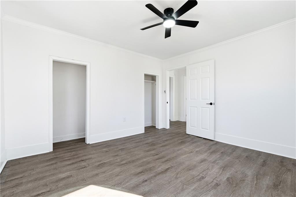 34 Wade Street Winder, GA 30680 - Photo 17 of 22 a view of an empty room with wooden floor