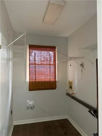 a bathroom with a bathtub and a window