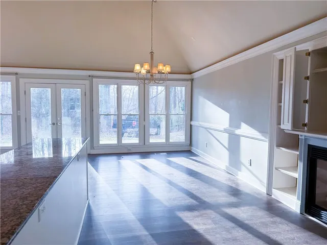a view of an entryway with wooden floor