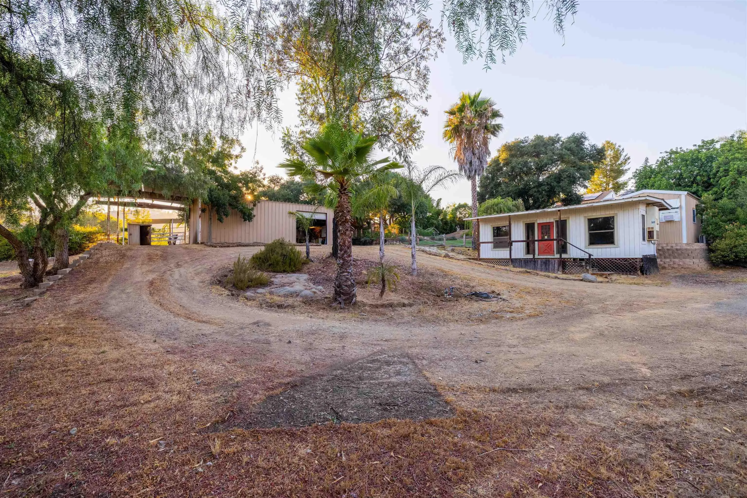 1454 Romance Road Escondido, CA 92029 - Photo 17 of 28 a view of a house with backyard and sitting area