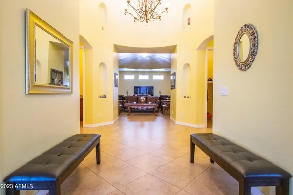 a dining room with furniture and window