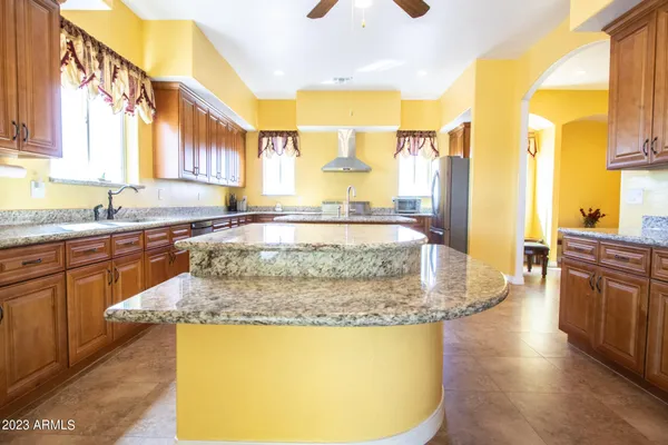 a bedroom with a bed and ceiling fan