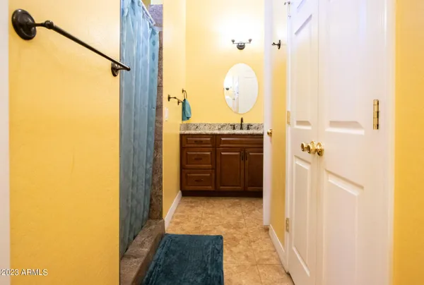 a kitchen with a table chairs refrigerator and microwave