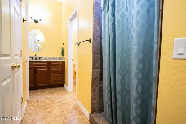 a kitchen with stainless steel appliances granite countertop a stove a sink dishwasher and a microwave oven with cabinets
