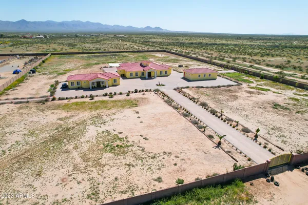 an aerial view of residential houses with outdoor space