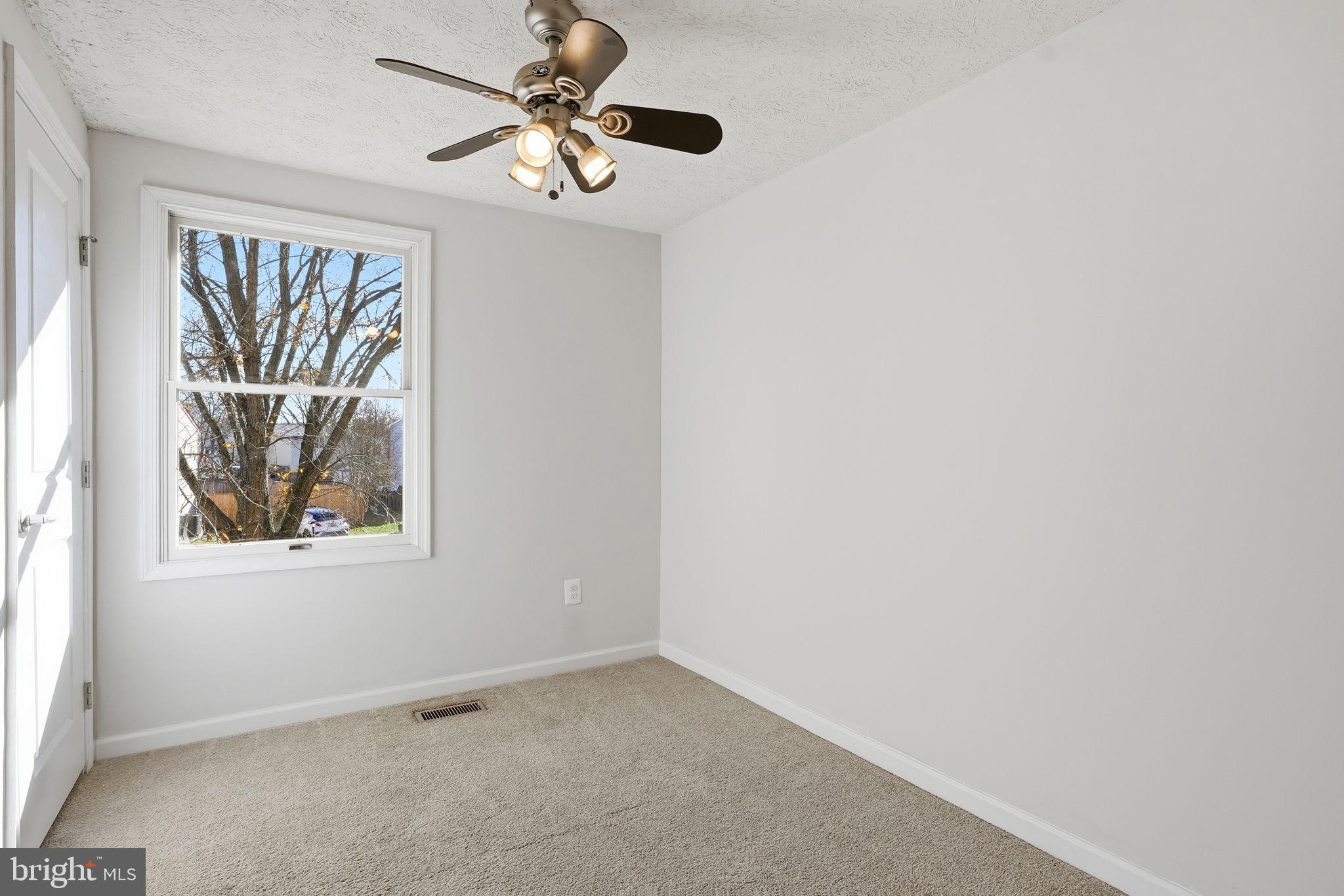 474 Ruffian Court Annapolis, MD 21409 - Photo 16 of 36 an empty room with windows and fan