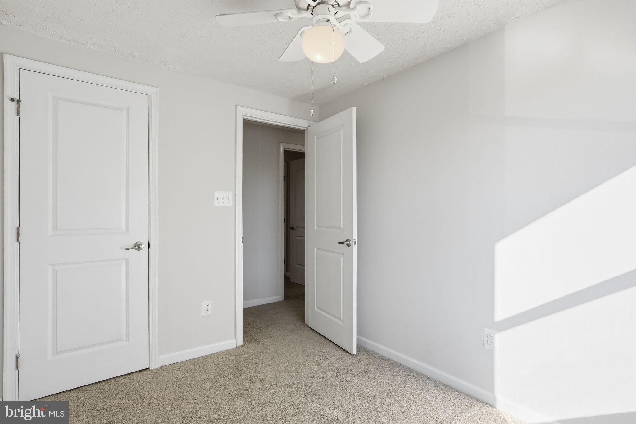 474 Ruffian Court Annapolis, MD 21409 - Photo 19 of 36 a view of a room with a chandelier fan