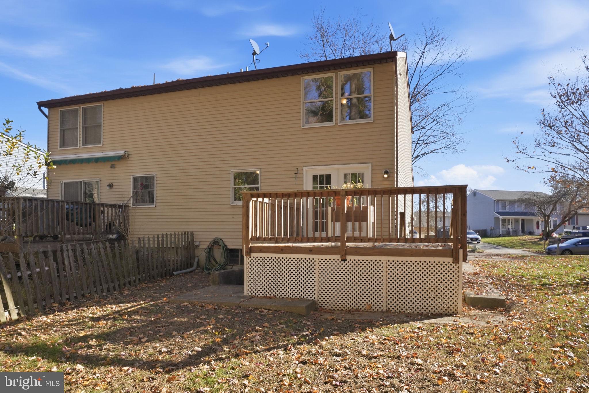 474 Ruffian Court Annapolis, MD 21409 - Photo 28 of 36 a view of a house with a wooden deck