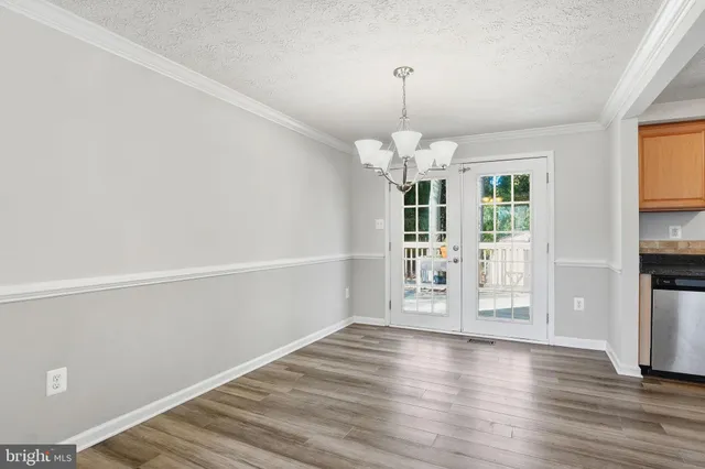 a view of a livingroom with wooden floor