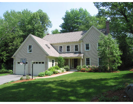 41 Woodcliffe Road Lexington, MA 02421 - Photo 1 of 26 a front view of a house with a yard and trees