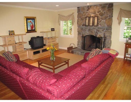 41 Woodcliffe Road Lexington, MA 02421 - Photo 13 of 26 a living room with furniture a fireplace and a flat screen tv
