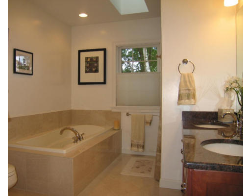 41 Woodcliffe Road Lexington, MA 02421 - Photo 21 of 26 a bathroom with a granite countertop tub sink and mirror